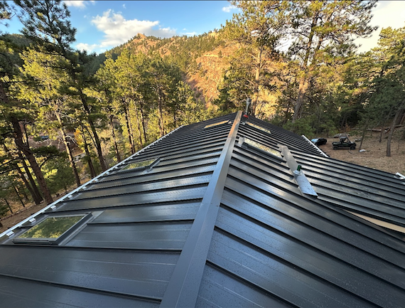 Standing seam metal roof installation in Colorado mountains