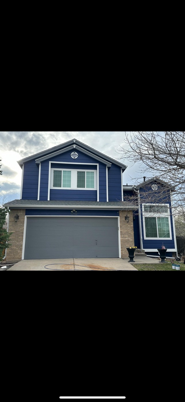 Beautiful blue house with metal roofing in Colorado